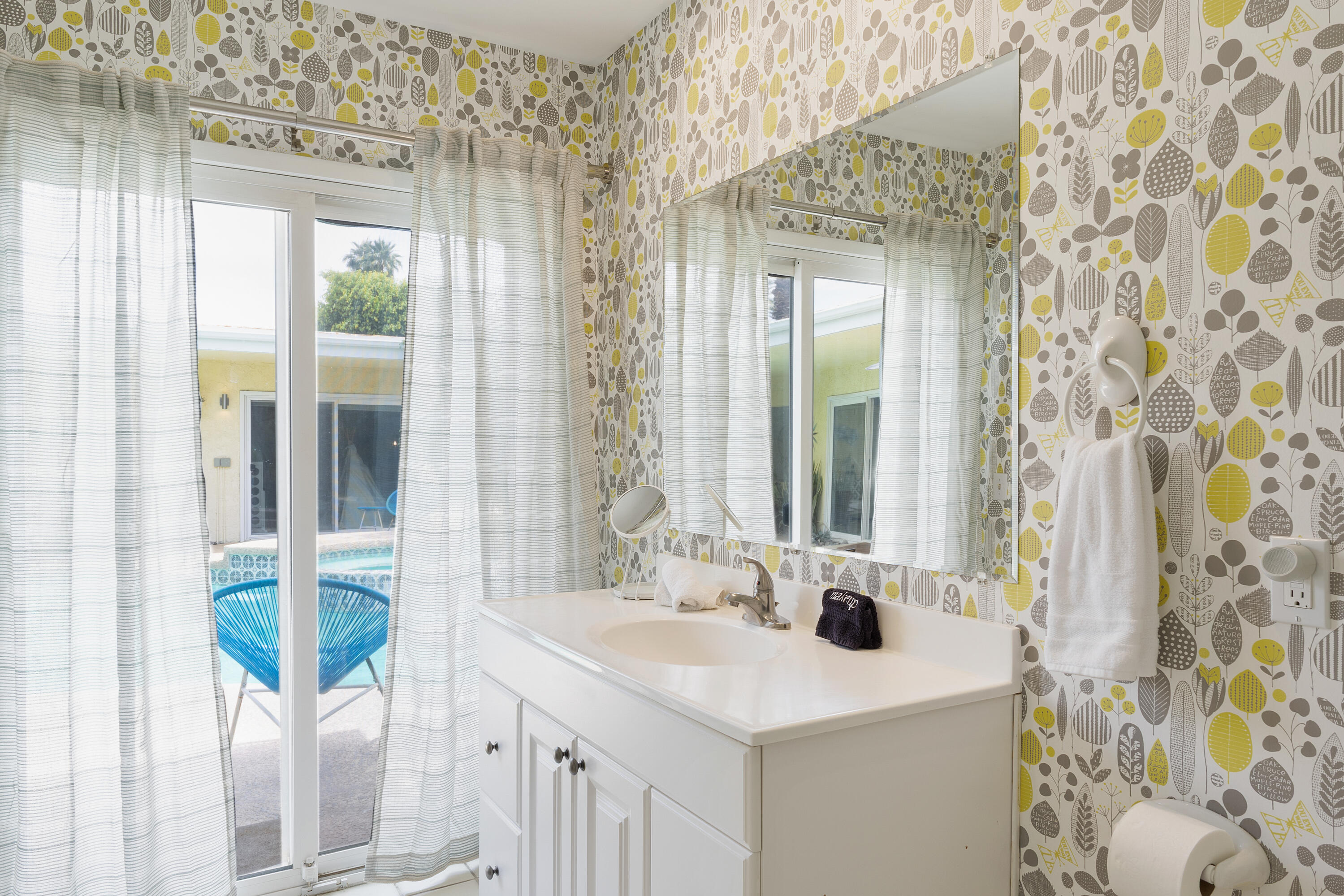 74533 Peppertree Drive Palm Desert, CA 92260 - Photo 18 of 34 a bathroom with a sink and a mirror