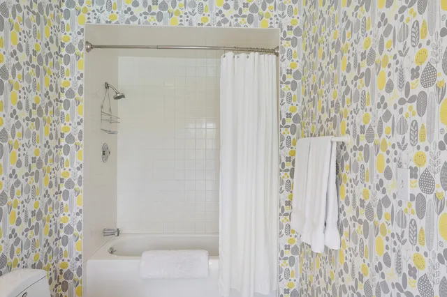 a bathroom with a shower curtain