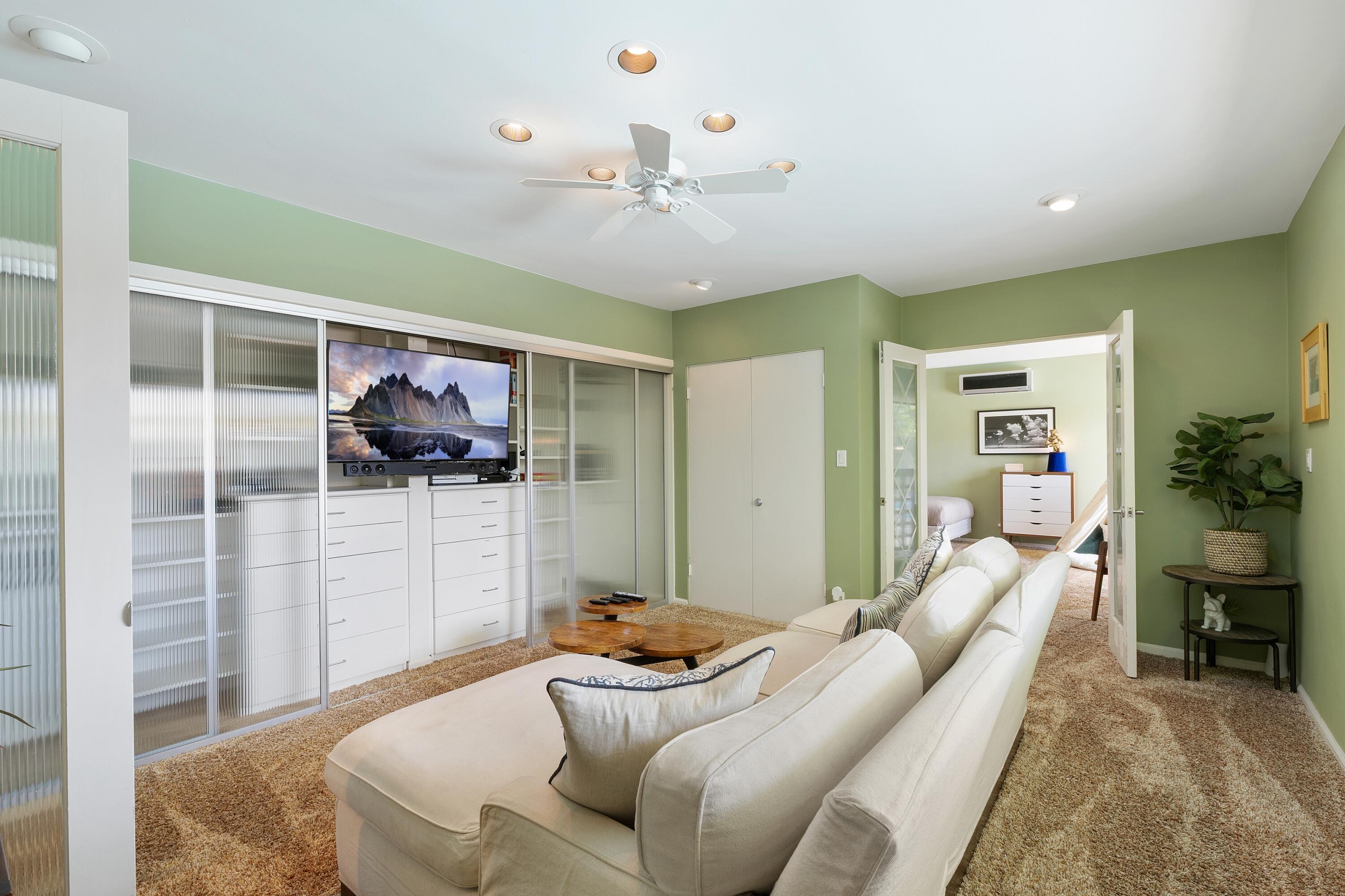 74533 Peppertree Drive Palm Desert, CA 92260 - Photo 20 of 34 a living room with furniture and a chandelier