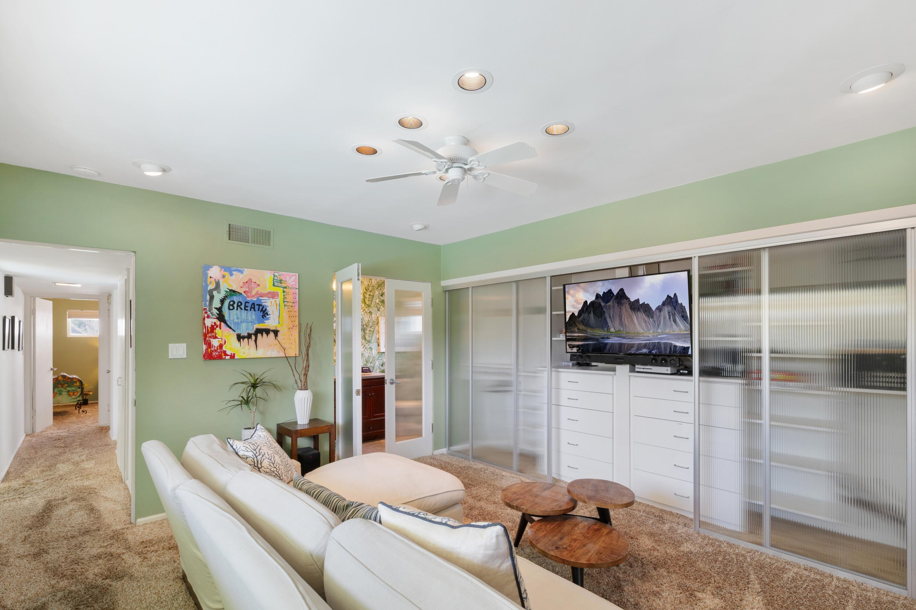 74533 Peppertree Drive Palm Desert, CA 92260 - Photo 22 of 34 a living room with furniture and a flat screen tv