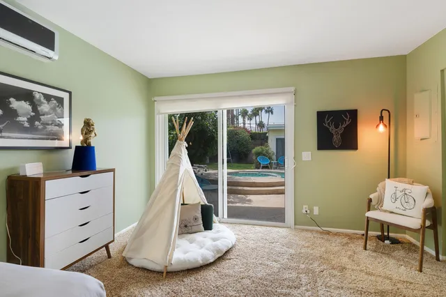 a view of a bedroom with furniture and staircase
