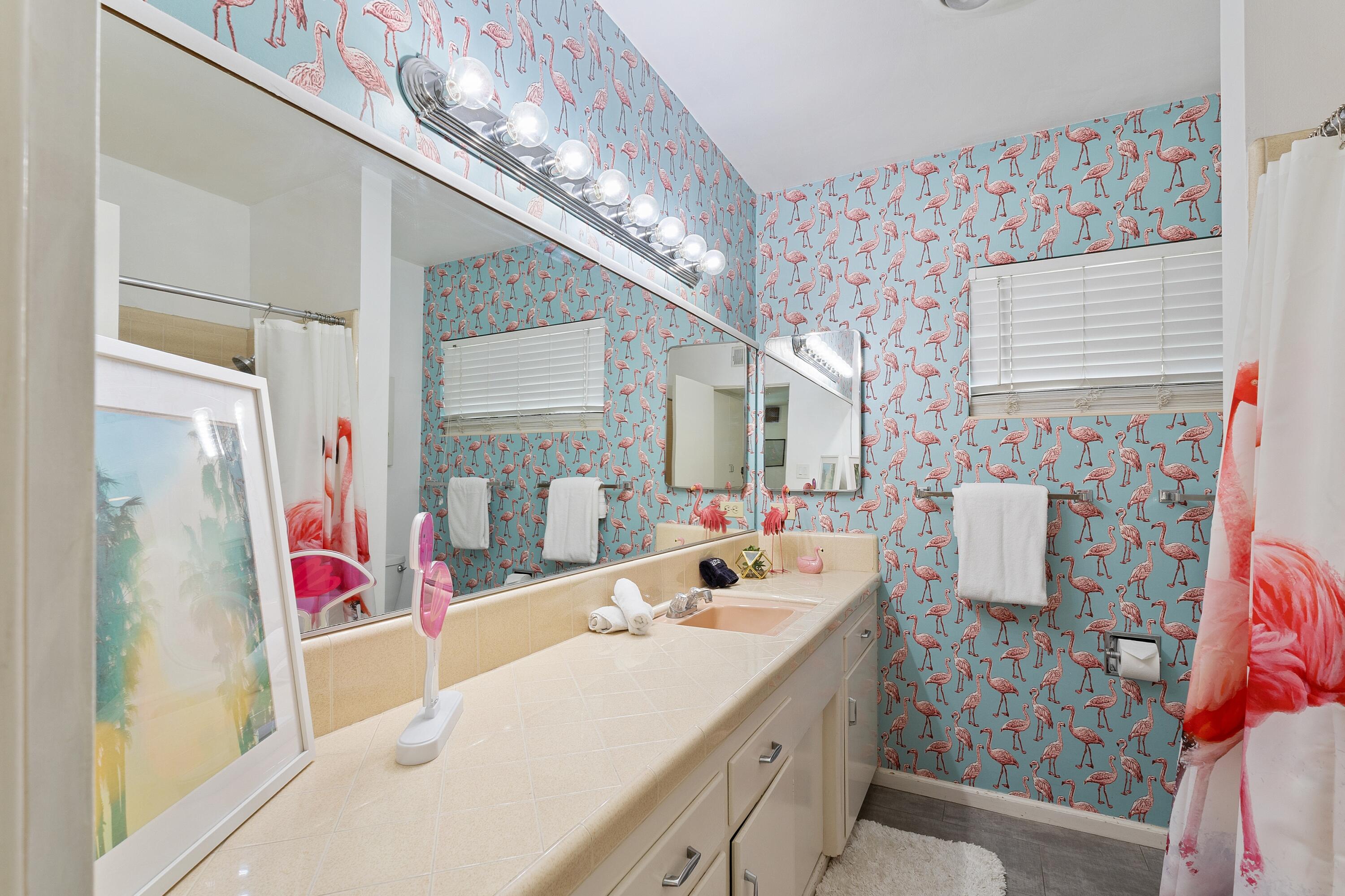 74533 Peppertree Drive Palm Desert, CA 92260 - Photo 29 of 34 a bathroom with a sink mirror and shower