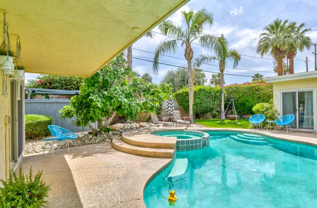 a view of a swimming pool with a patio