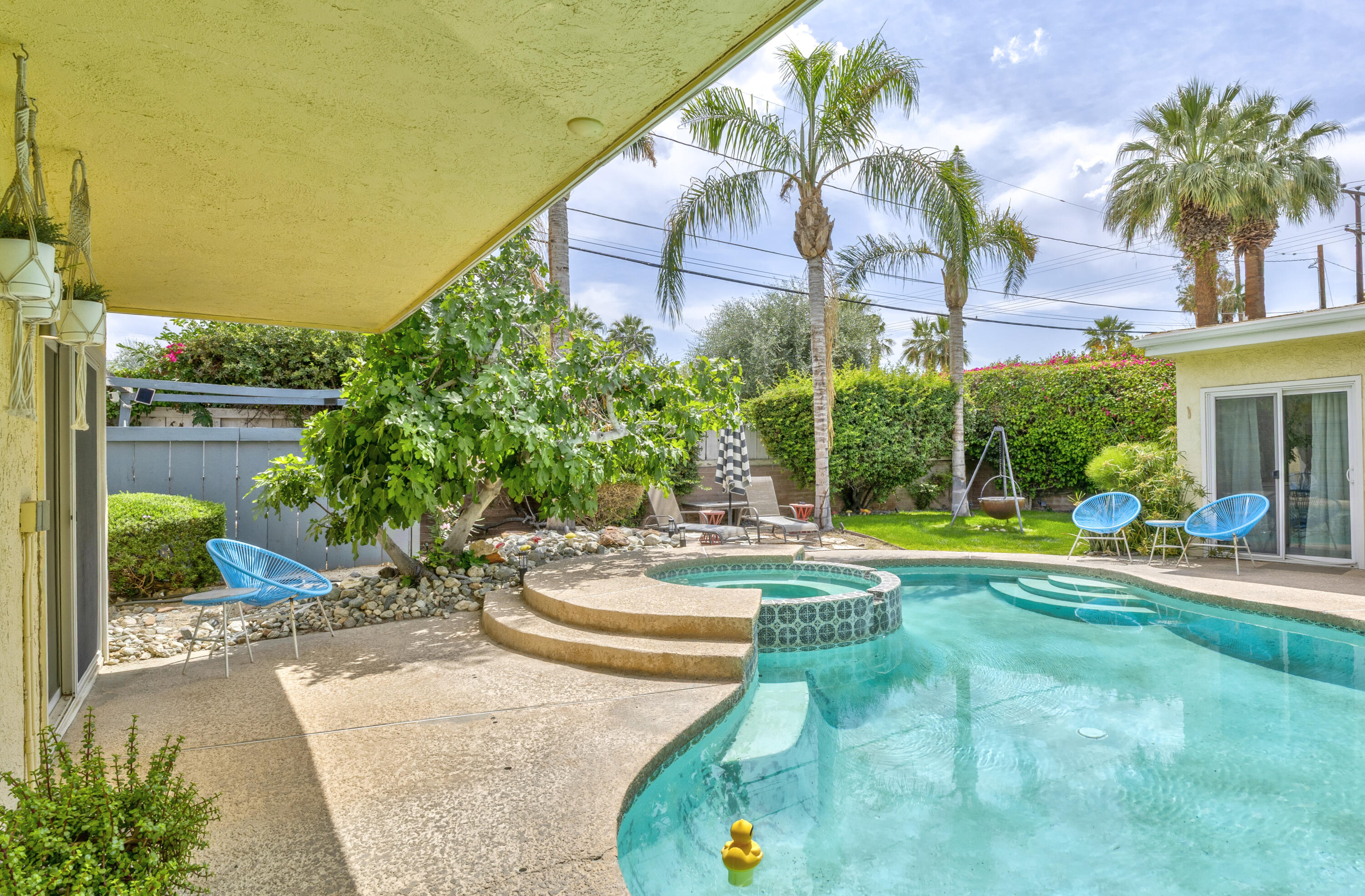 74533 Peppertree Drive Palm Desert, CA 92260 - Photo 31 of 34 a view of a swimming pool with a patio