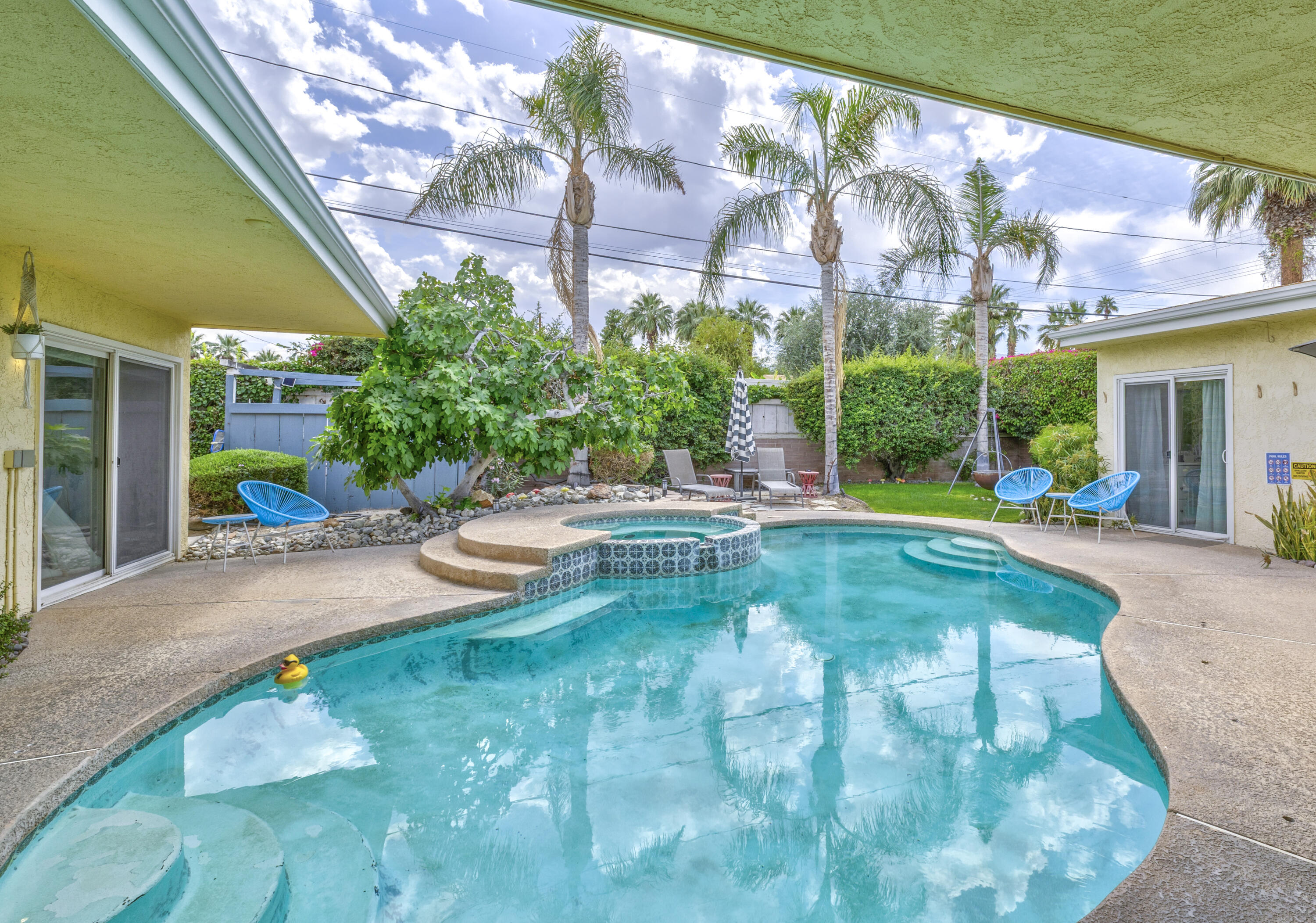 74533 Peppertree Drive Palm Desert, CA 92260 - Photo 34 of 34 a view of swimming pool with outdoor seating and a patio