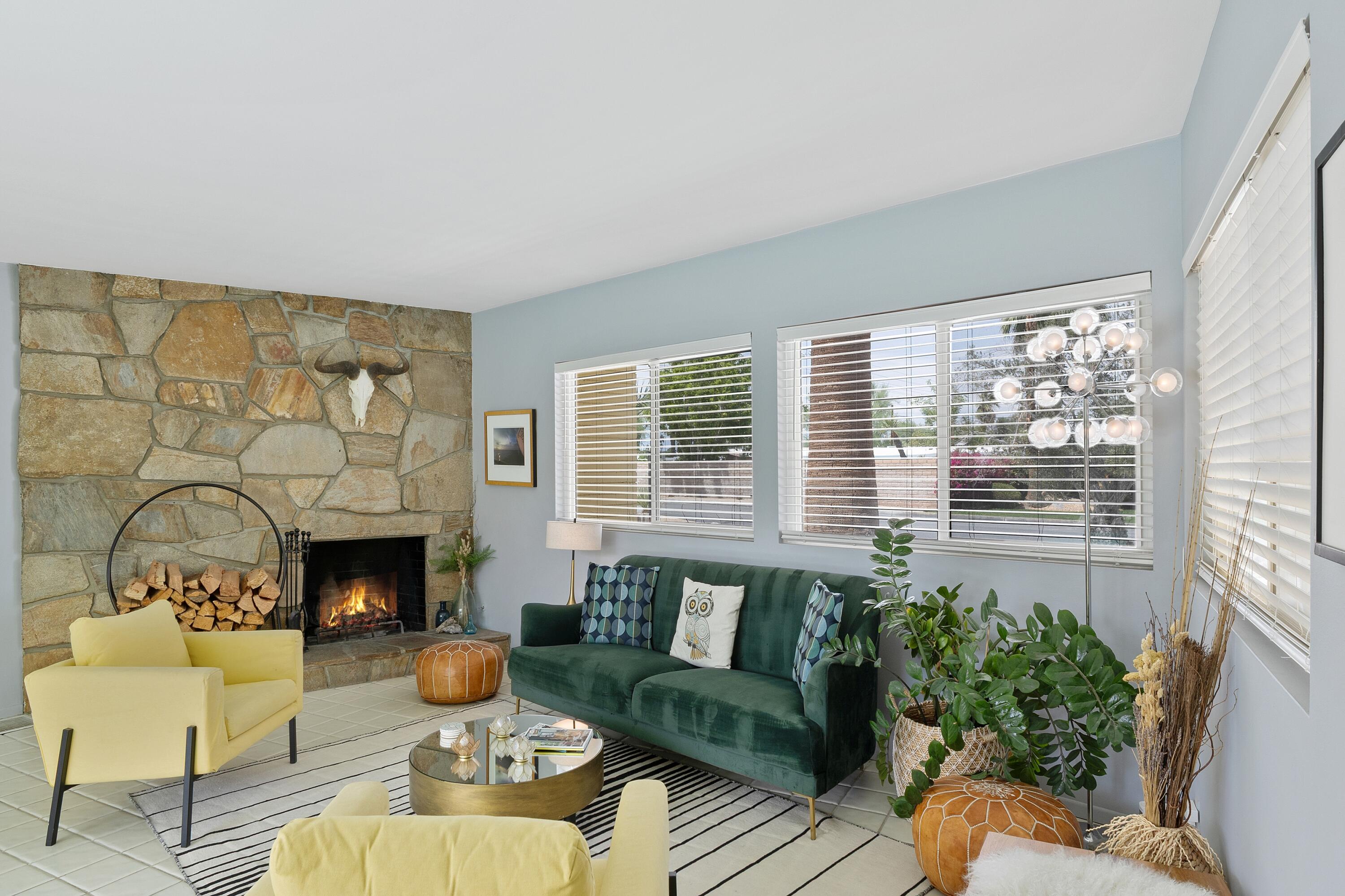 74533 Peppertree Drive Palm Desert, CA 92260 - Photo 5 of 34 a living room with furniture and a fireplace