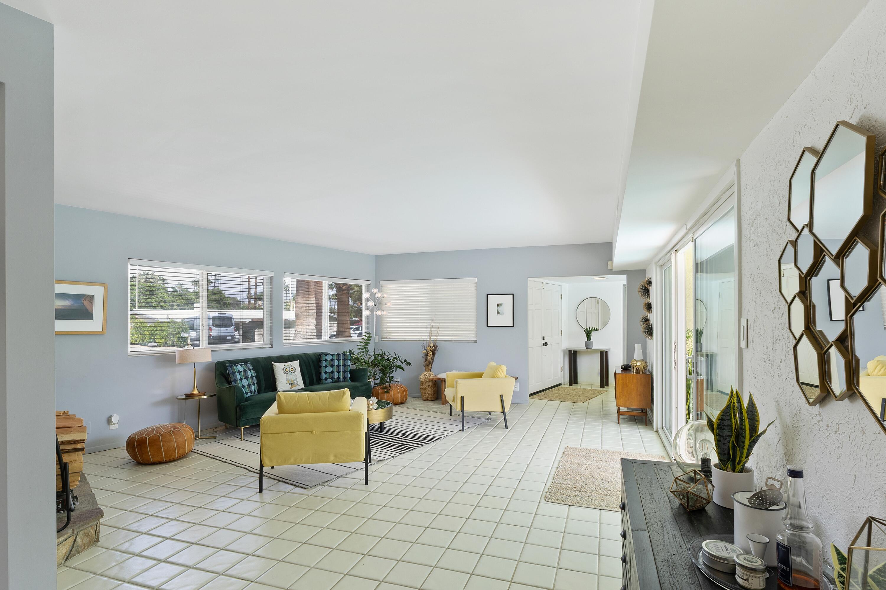 74533 Peppertree Drive Palm Desert, CA 92260 - Photo 8 of 34 a living room with furniture and a table