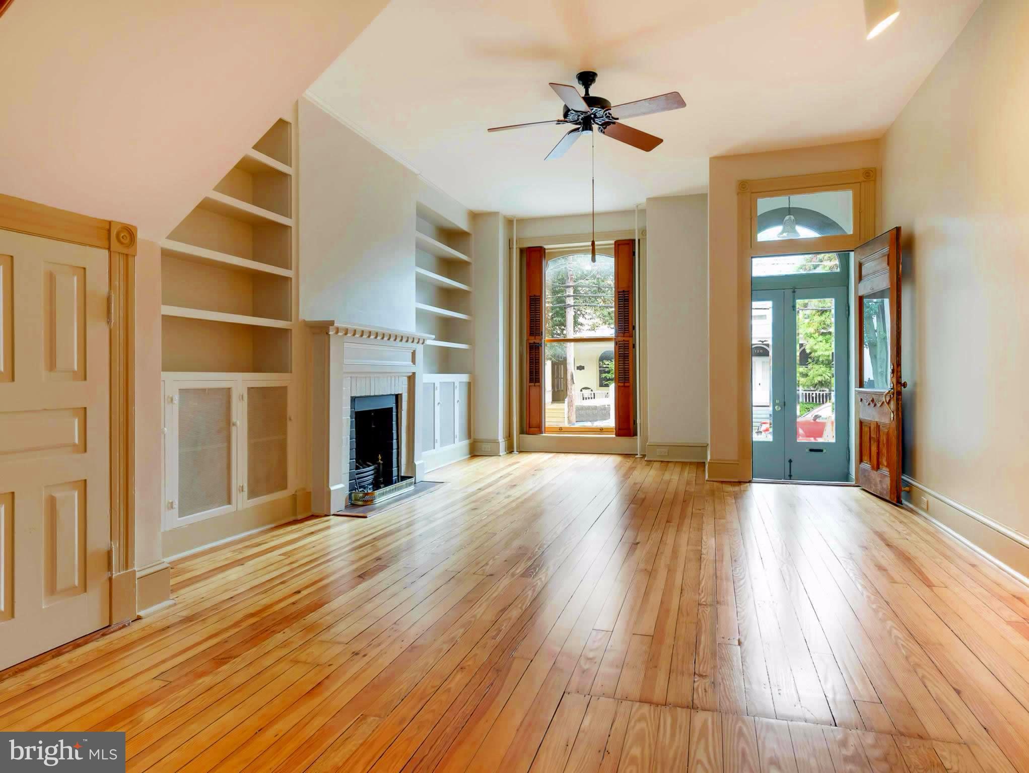 123 East 3rd Street Frederick, MD 21701 - Photo 2 of 28 a view of an empty room with wooden floor and a window