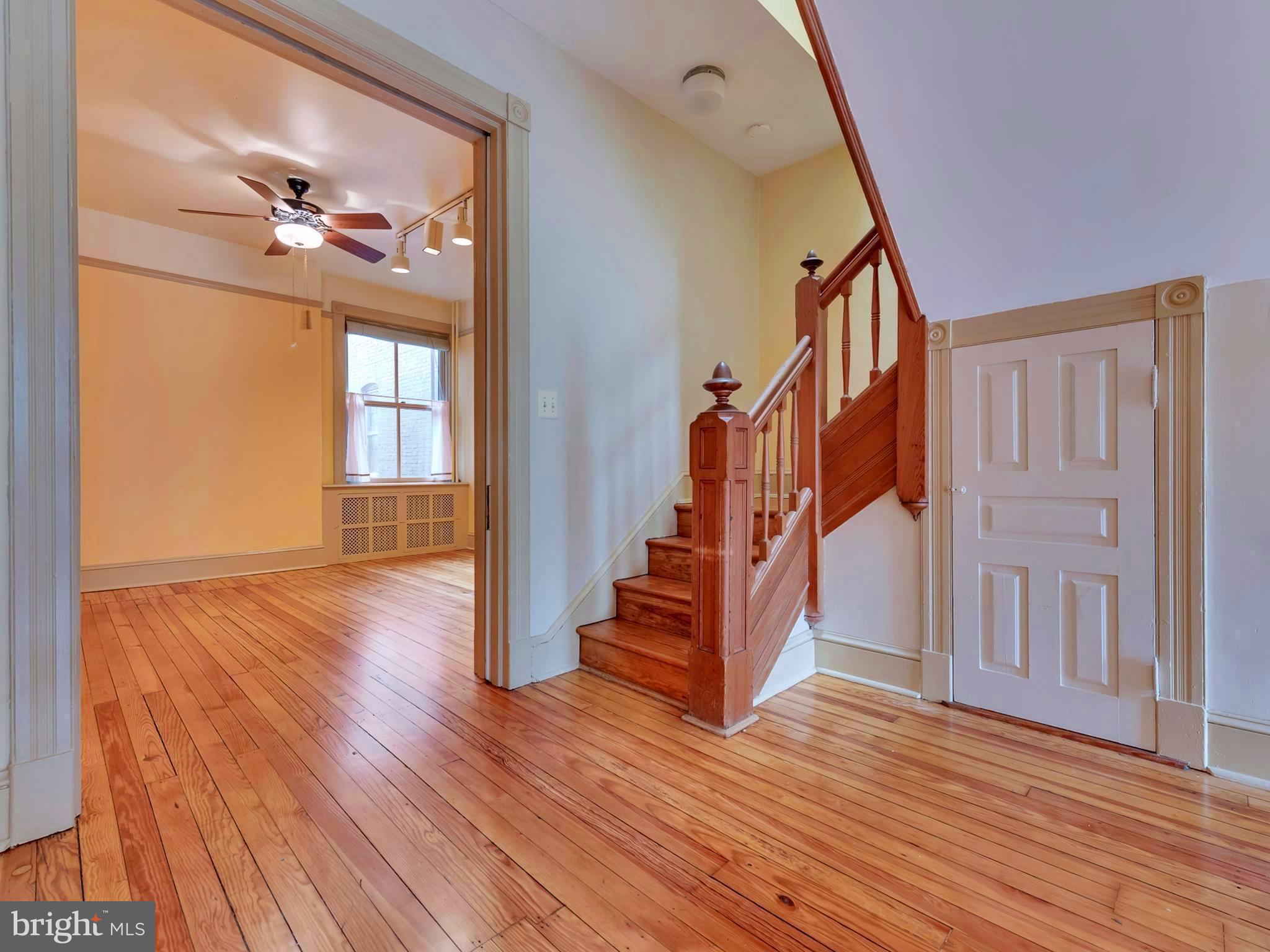 123 East 3rd Street Frederick, MD 21701 - Photo 12 of 28 a view of an entryway with wooden floor and stairs