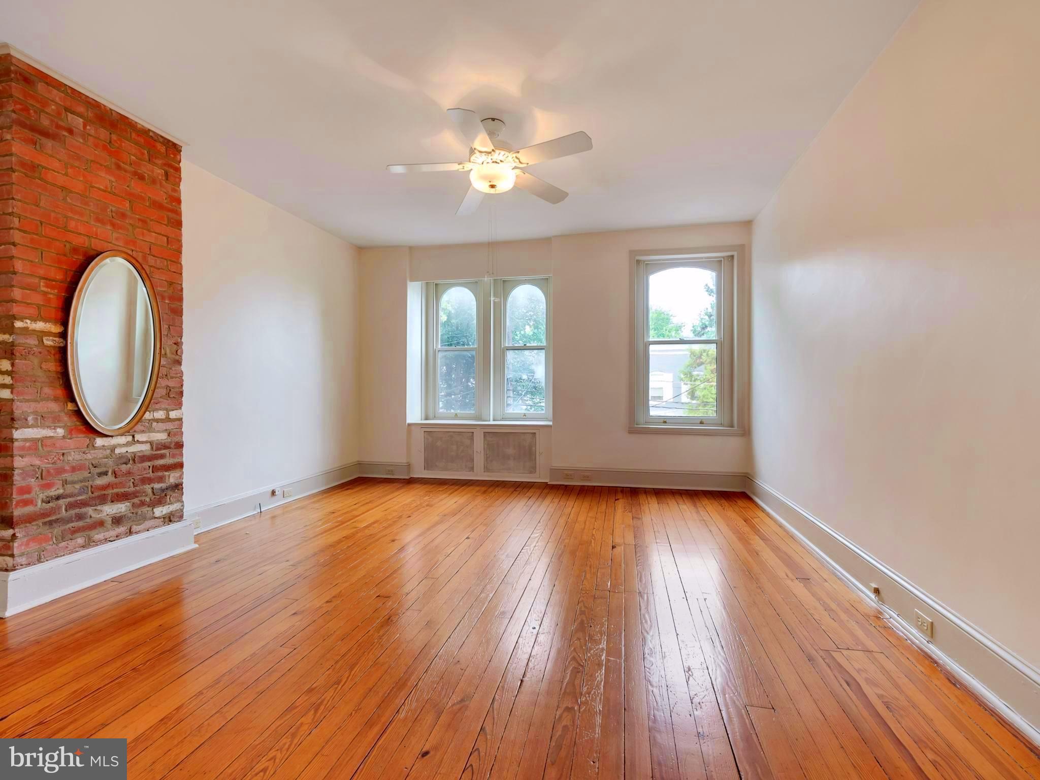 123 East 3rd Street Frederick, MD 21701 - Photo 13 of 28 a view of an empty room with wooden floor and a window