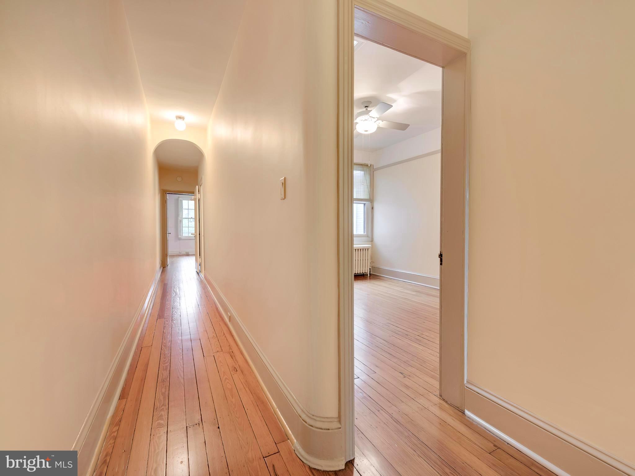 123 East 3rd Street Frederick, MD 21701 - Photo 16 of 28 a view of a hallway with wooden floor