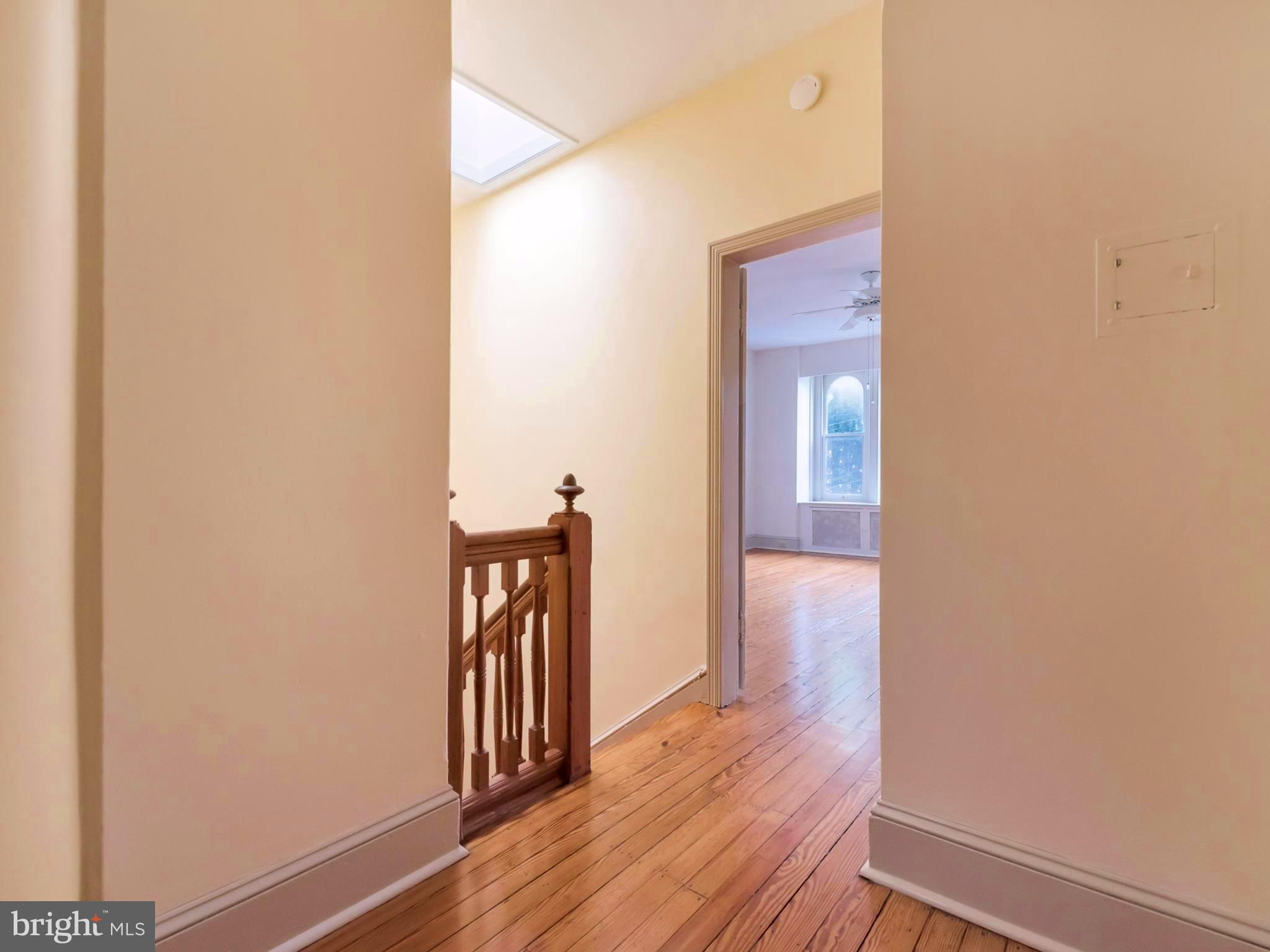 123 East 3rd Street Frederick, MD 21701 - Photo 21 of 28 a view of a hallway with wooden floor