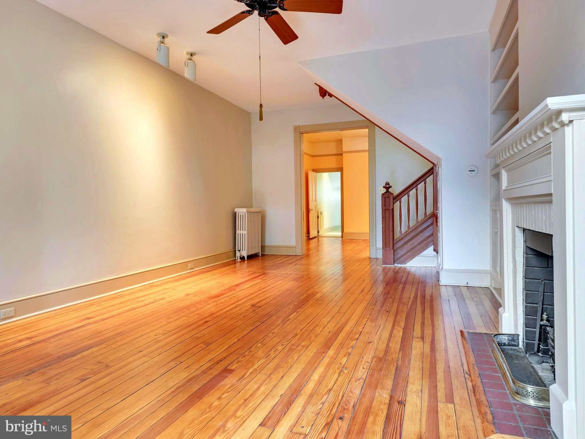 123 East 3rd Street Frederick, MD 21701 - Photo 4 of 28 a view of empty room with wooden floor and fan