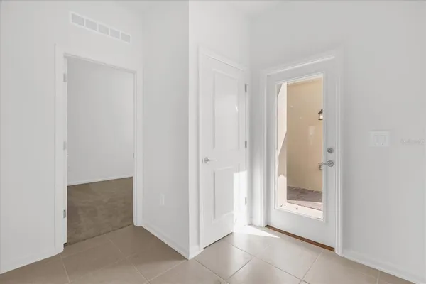 a view of a bathroom with a glass door