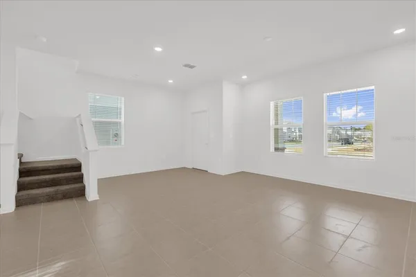 an empty room with windows