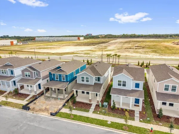 an aerial view of residential building with beach and ocean view