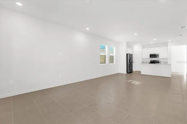 a view of an empty room with a window