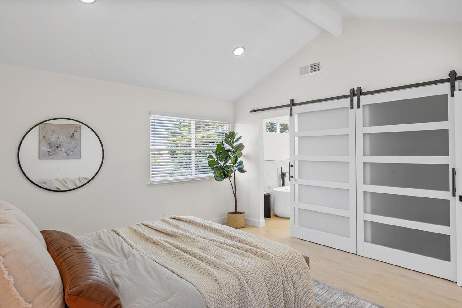 7531 Event Way Sacramento, CA 95842 - Photo 25 of 36 Master bedroom featuring recessed lighting and barn doors