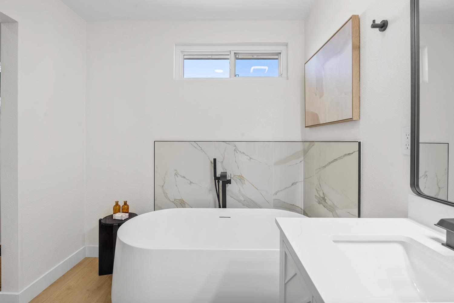 7531 Event Way Sacramento, CA 95842 - Photo 28 of 36 bathroom with a freestanding bath and vanity