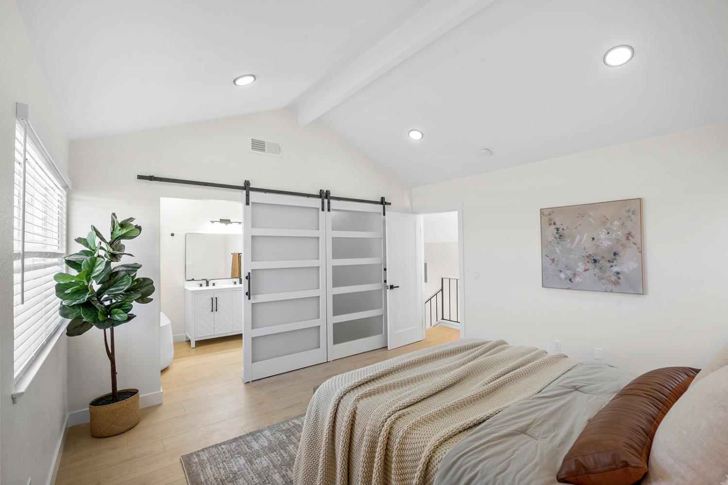 7531 Event Way Sacramento, CA 95842 - Photo 30 of 36 bedroom with 2 barn doors, recessed lighting, connected bathroom, and walk in closet.