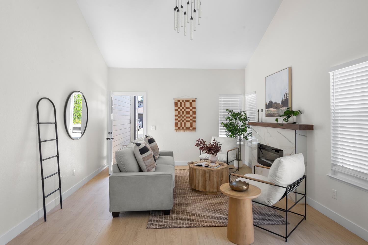 7531 Event Way Sacramento, CA 95842 - Photo 4 of 36 living room featuring high vaulted ceiling and laminate floors