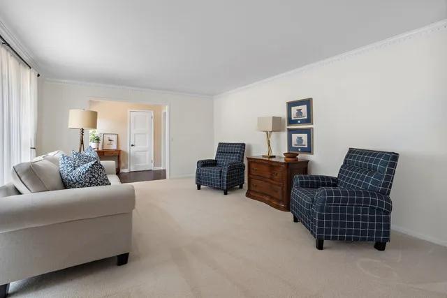 a view of a kitchen with stainless steel appliances granite countertop a stove and a window