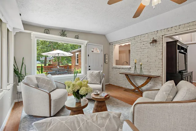 a view of a house with backyard and a garden