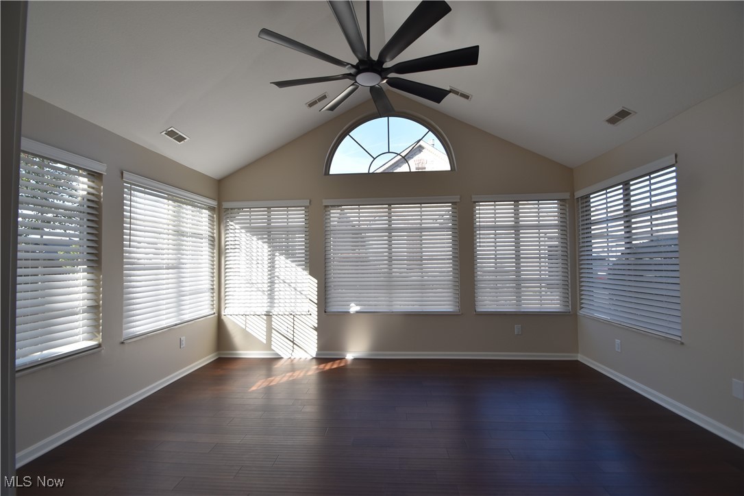 9151 Springfield Road, Unit 1002 Youngstown, OH 44514 - Photo 20 of 38 Spare room with dark hardwood / wood-style floors, ceiling fan, and vaulted ceiling