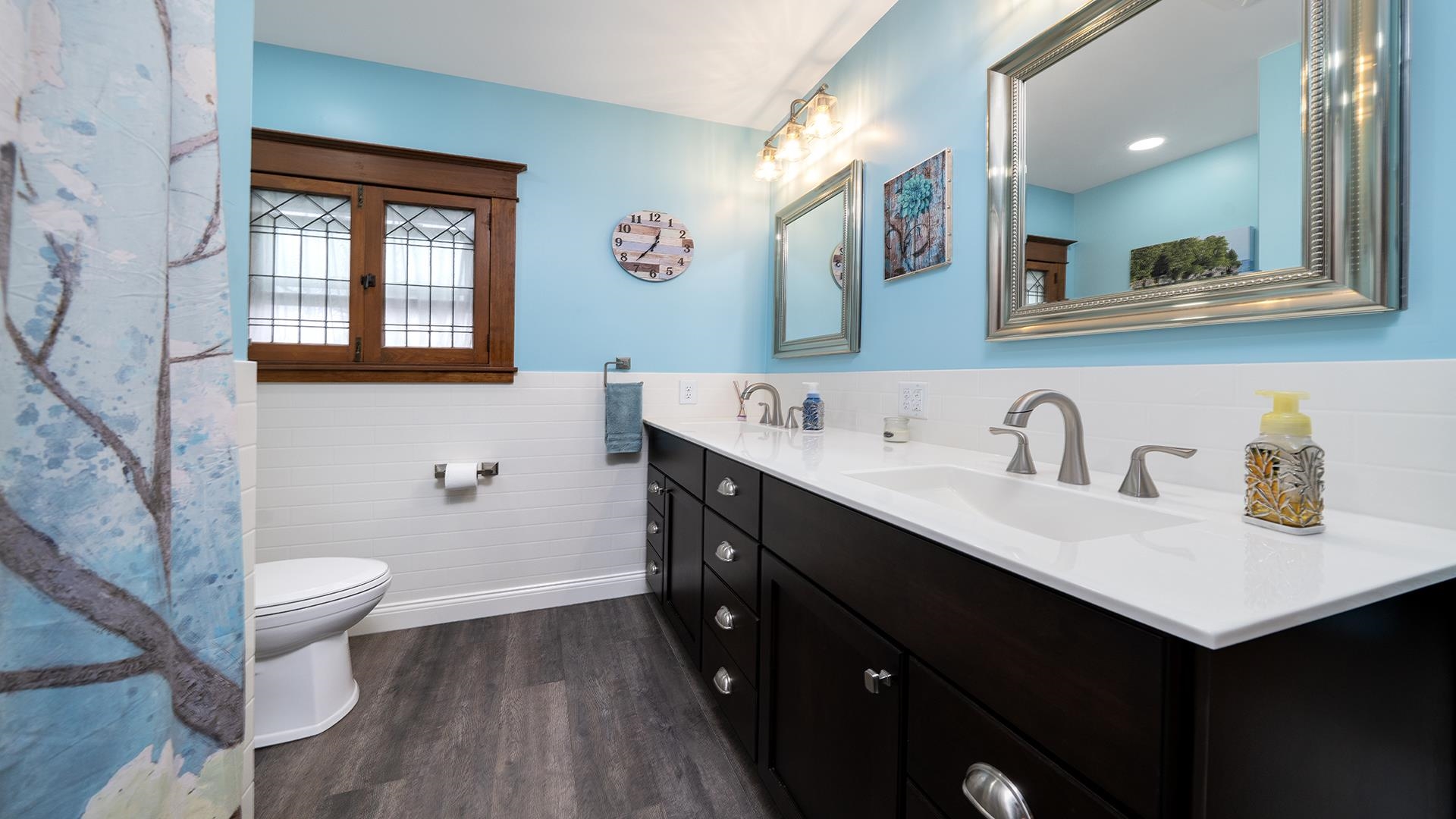 915 North 8th Street Rochelle, IL 61068 - Photo 15 of 38 a bathroom with a sink mirror and a toilet