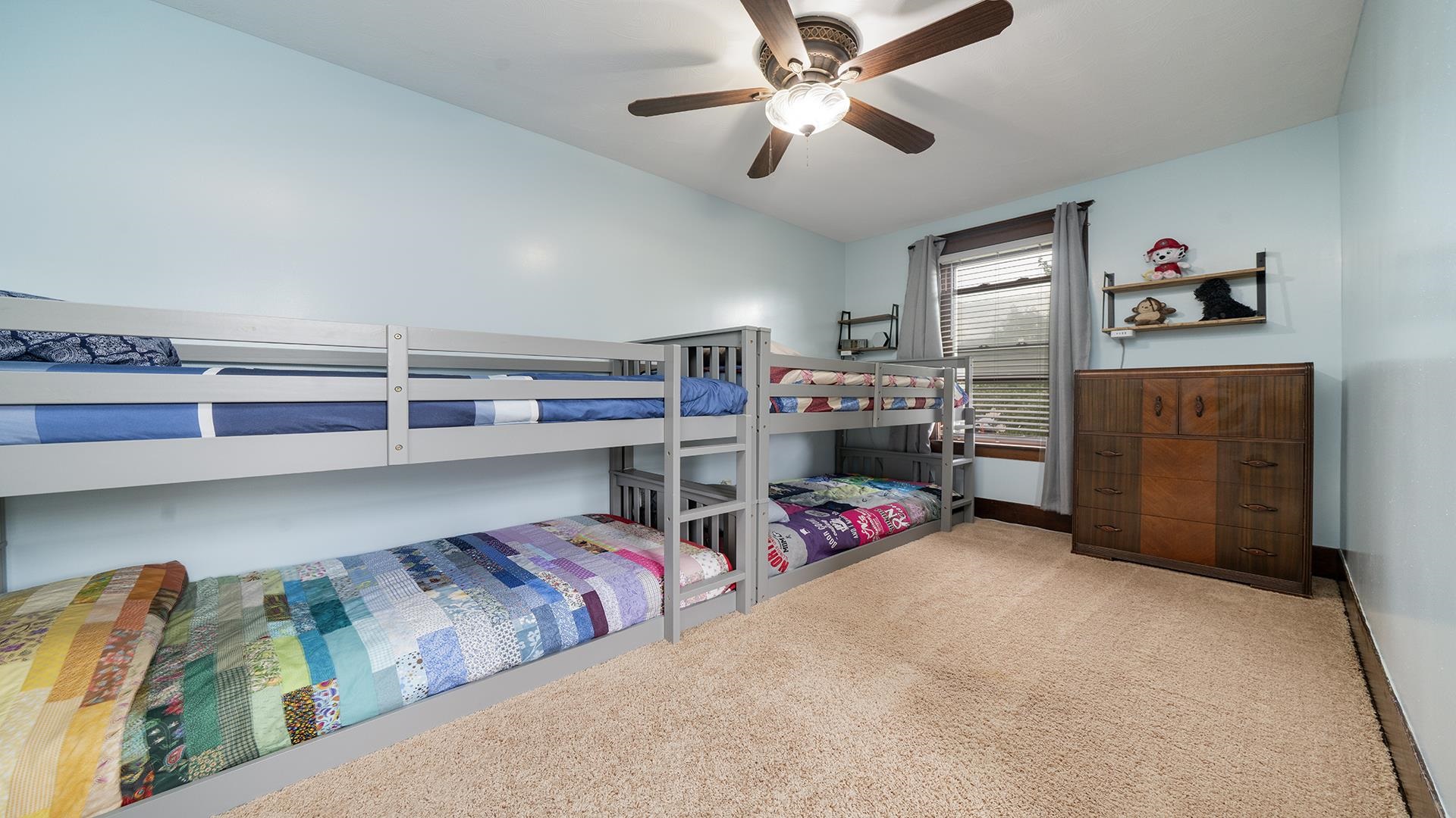 915 North 8th Street Rochelle, IL 61068 - Photo 18 of 38 a bedroom with furniture and a chandelier