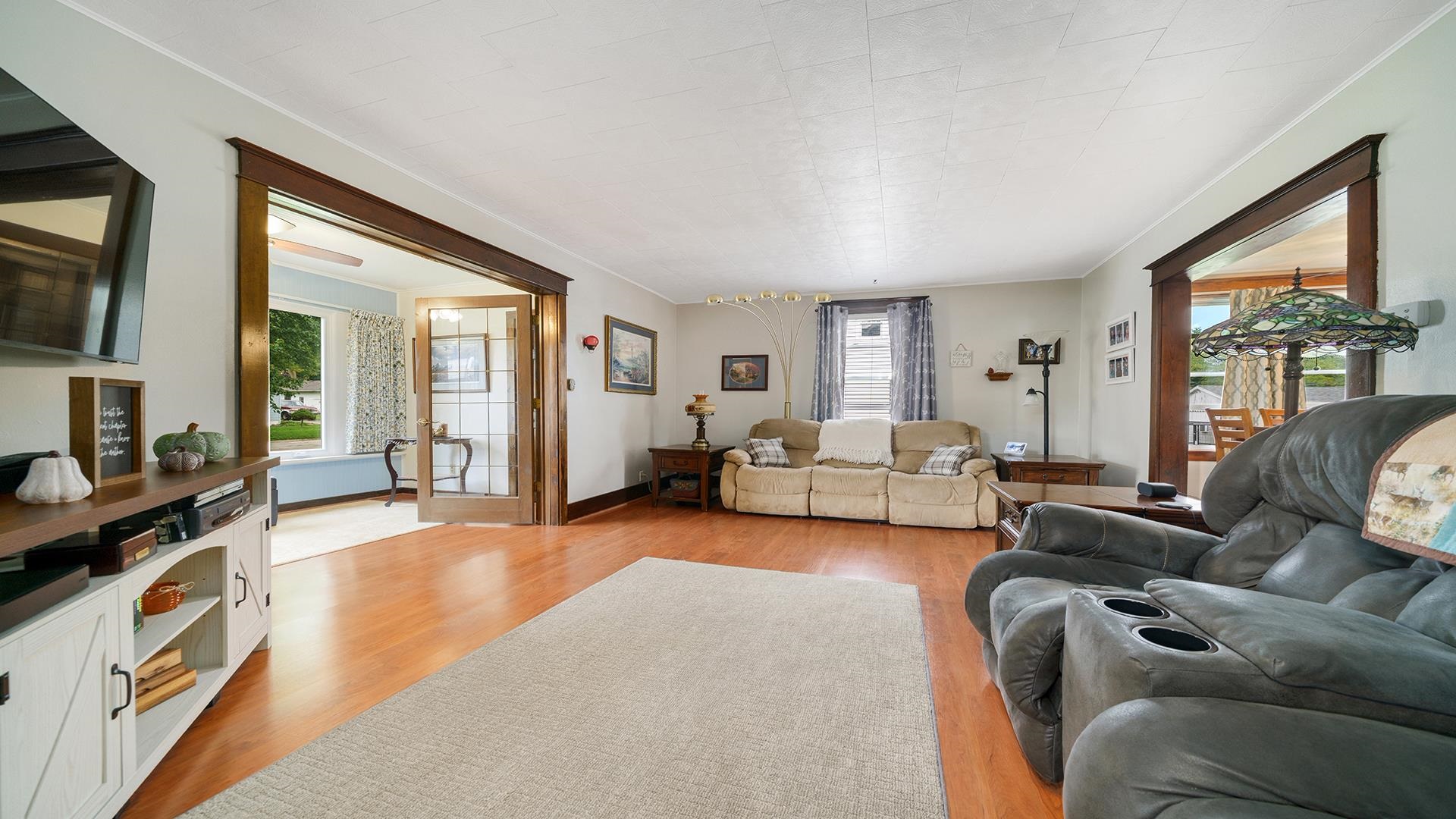 915 North 8th Street Rochelle, IL 61068 - Photo 2 of 38 a living room with furniture large window and a flat screen tv