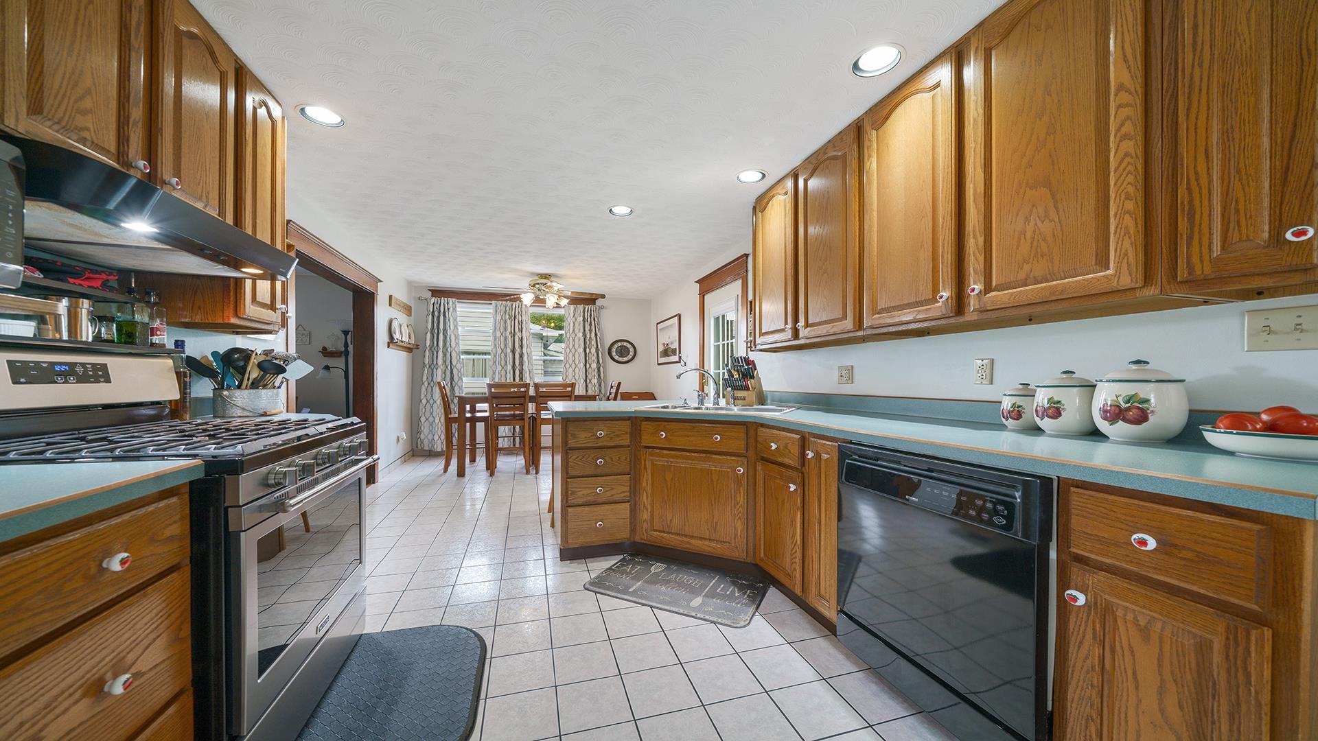 915 North 8th Street Rochelle, IL 61068 - Photo 5 of 38 a kitchen with stainless steel appliances granite countertop a stove top oven a sink dishwasher and cabinets with wooden floor