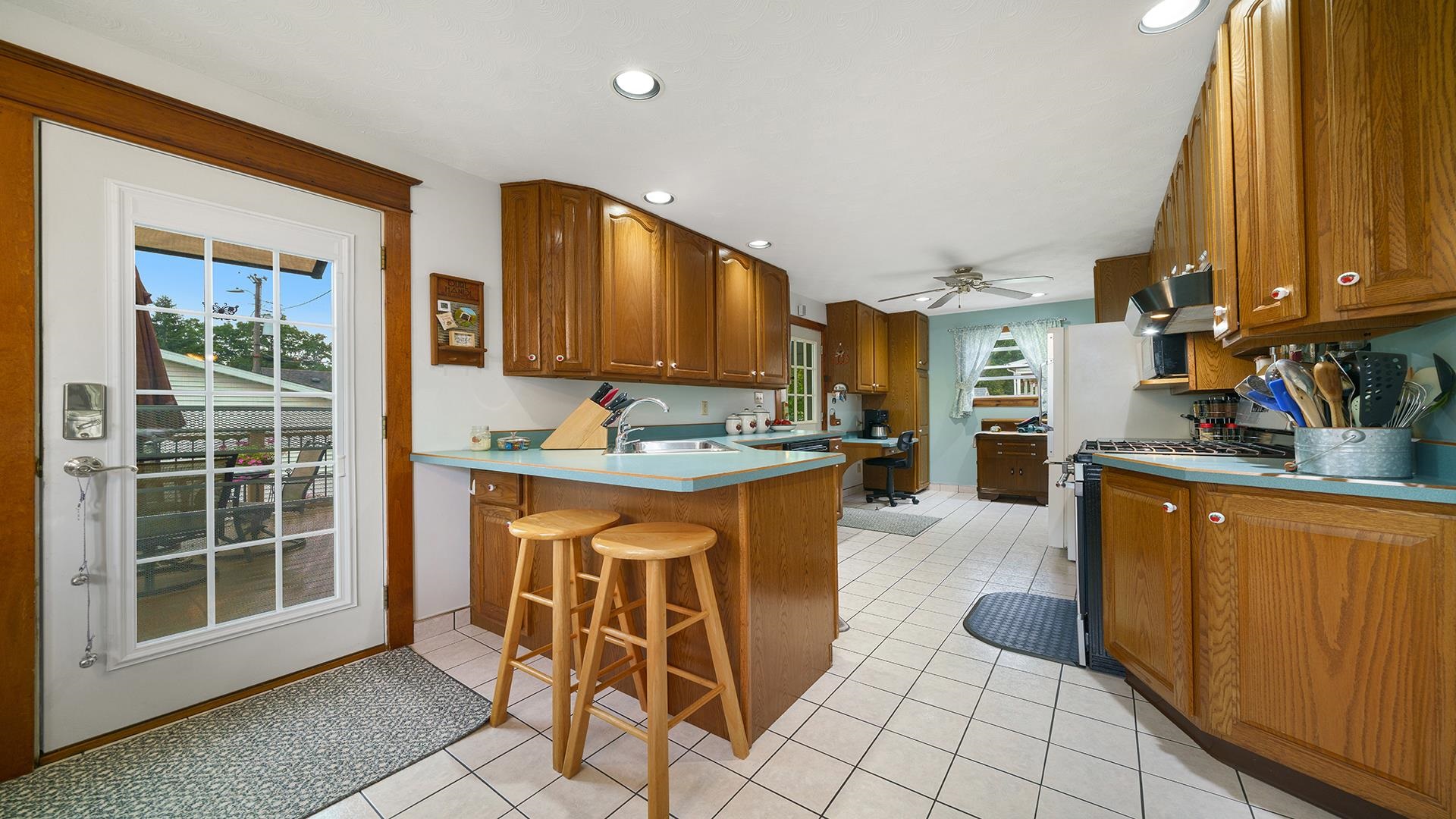 915 North 8th Street Rochelle, IL 61068 - Photo 7 of 38 a kitchen with stainless steel appliances granite countertop a stove a sink and a refrigerator