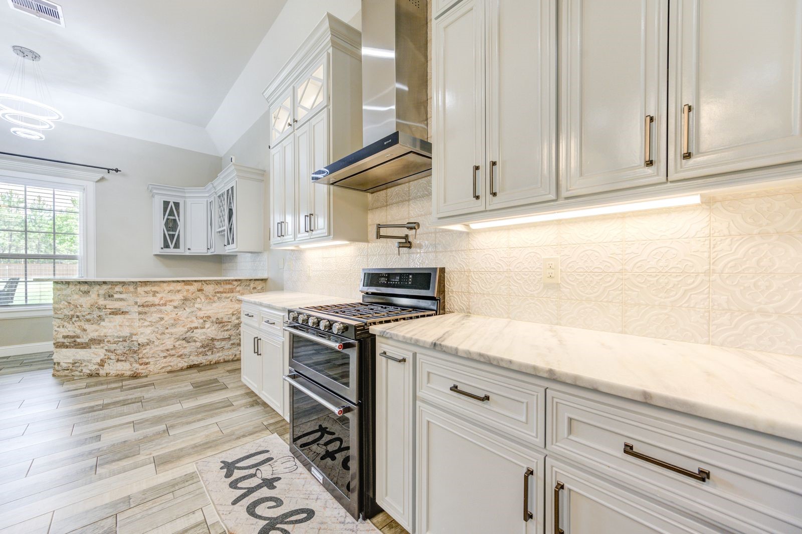 21038 Angus Drive Cleveland, TX 77328 - Photo 12 of 49 a kitchen with granite countertop white cabinets and white appliances