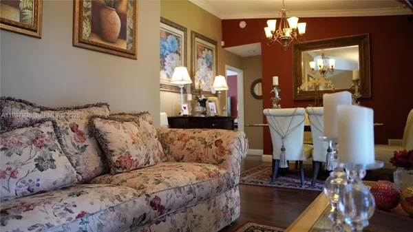 a dining room with furniture and wooden floor