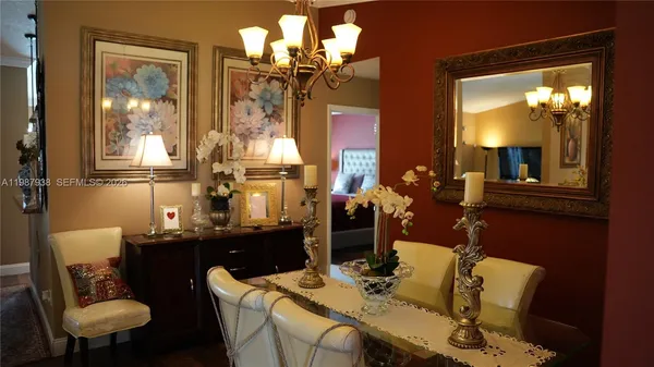 a living room with furniture and a mirror