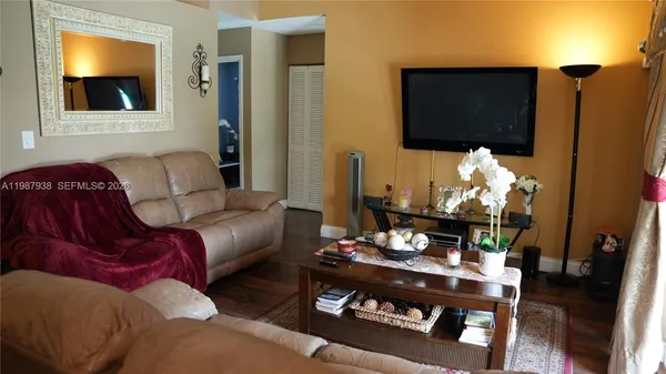 a kitchen with stainless steel appliances granite countertop a stove and a microwave