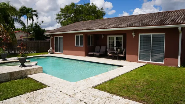 a view of a backyard with a garden