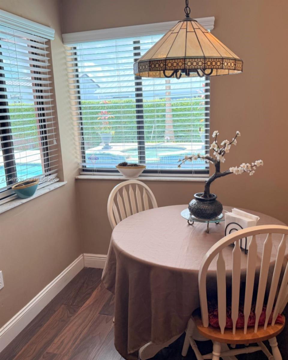 14856 Southwest 174th Street Miami, FL 33187 - Photo 22 of 28 a dining room with furniture and window