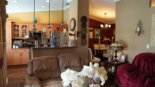 a living room with furniture and a lamp