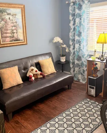 a bed room with furniture and a painting