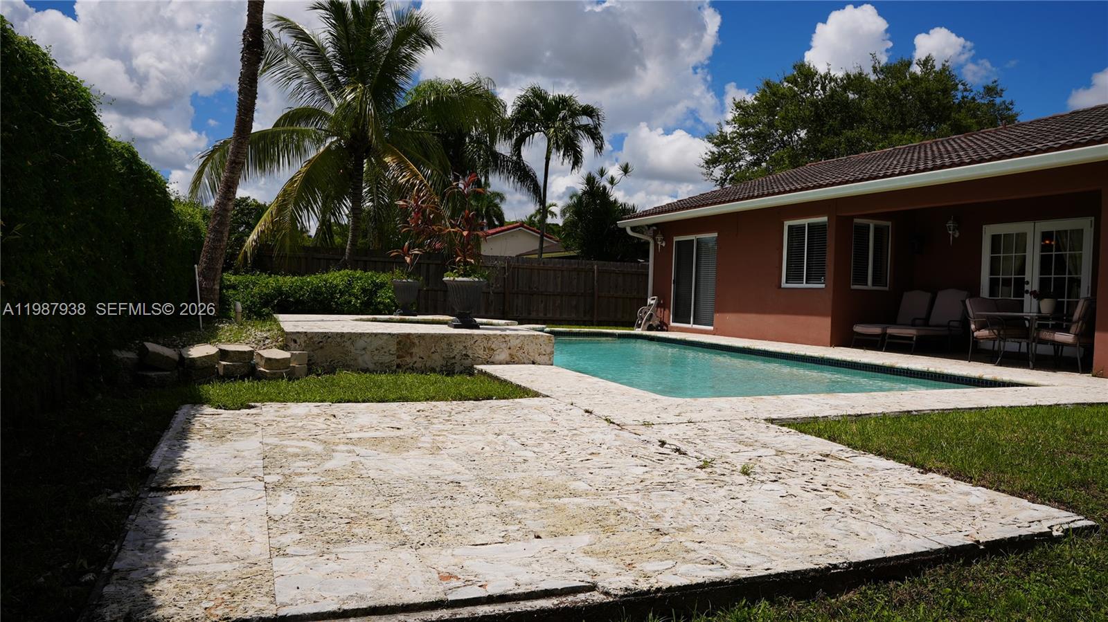 14856 Southwest 174th Street Miami, FL 33187 - Photo 3 of 28 a view of a backyard with a garden
