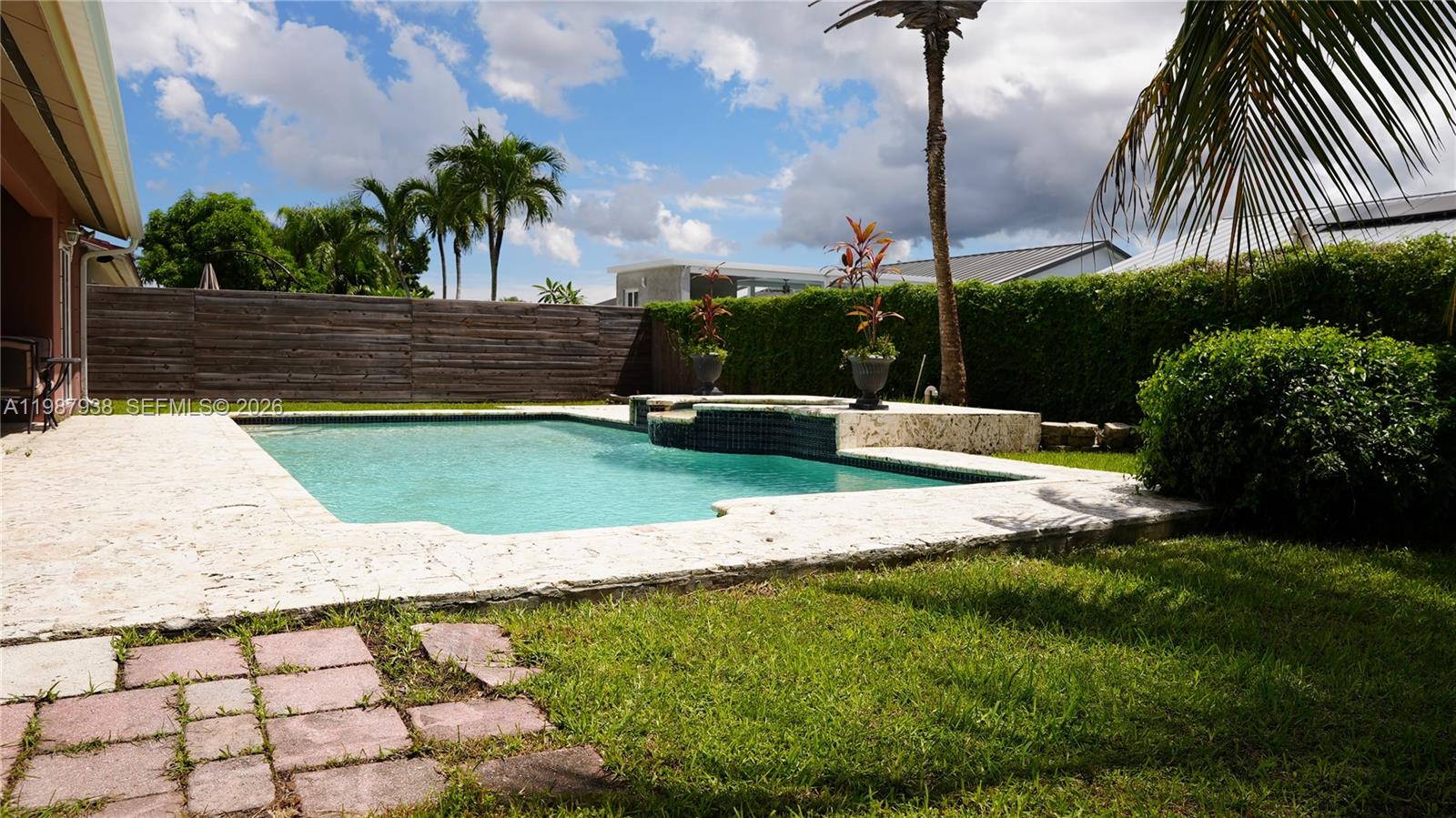 14856 Southwest 174th Street Miami, FL 33187 - Photo 8 of 28 a view of a backyard