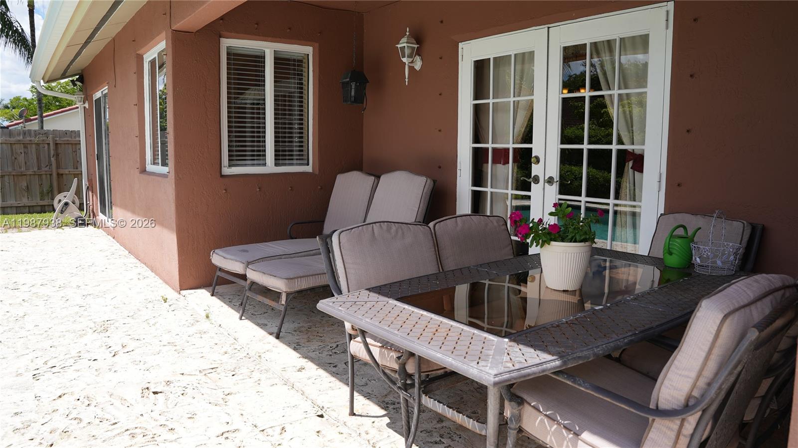 14856 Southwest 174th Street Miami, FL 33187 - Photo 10 of 28 a view of a dining room with furniture and front door