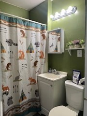 491-493 Newbury Street Springfield, MA 01104 - Photo 12 of 16 a bathroom with a sink toilet and shower