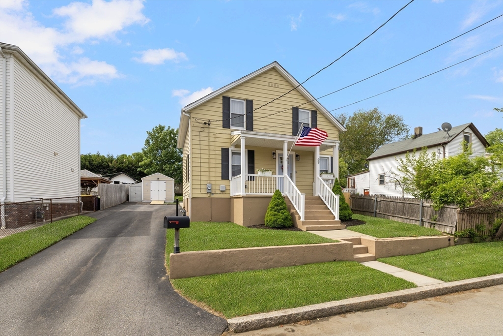 69 Denver Street Fall River, MA 02721 - Photo 2 of 35 a front view of a house with a yard