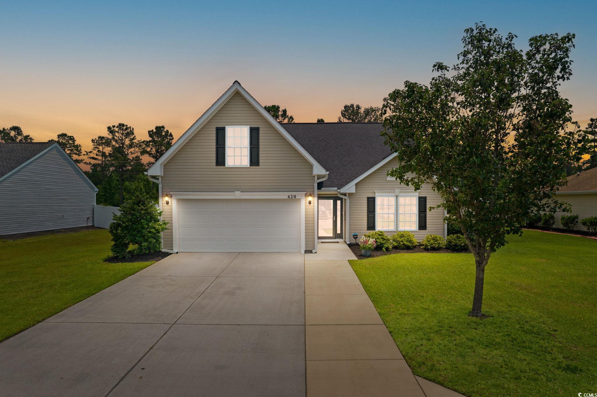 620 Seth Lane Longs, SC 29568 - Photo 1 of 35 Traditional-style house featuring an attached garage, concrete driveway, and a lawn