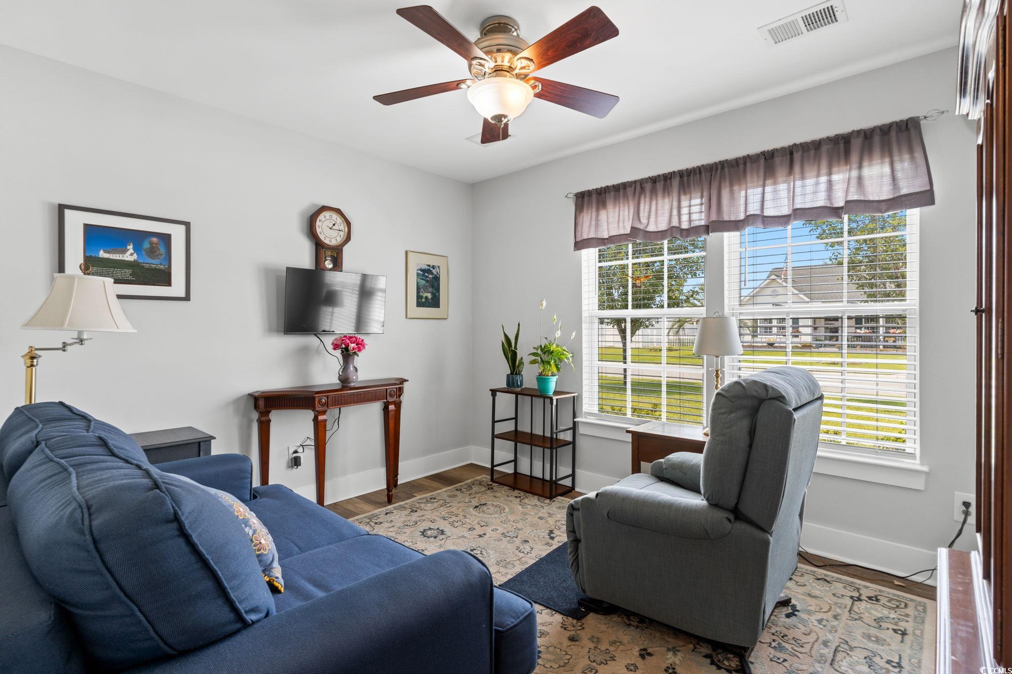 620 Seth Lane Longs, SC 29568 - Photo 18 of 35 Living room featuring healthy amount of natural light, baseboards, and ceiling fan