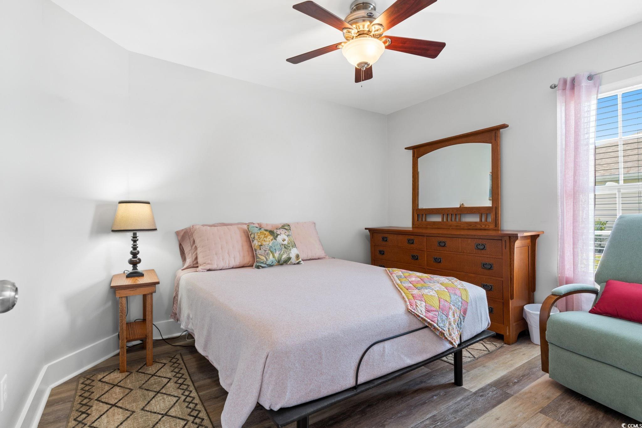 620 Seth Lane Longs, SC 29568 - Photo 20 of 35 Bedroom featuring light wood-style flooring, ceiling fan, and baseboards