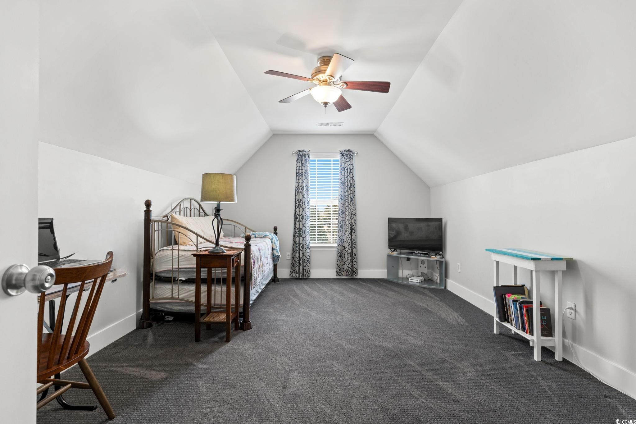 620 Seth Lane Longs, SC 29568 - Photo 23 of 35 Carpeted bedroom with vaulted ceiling, baseboards, and a ceiling fan